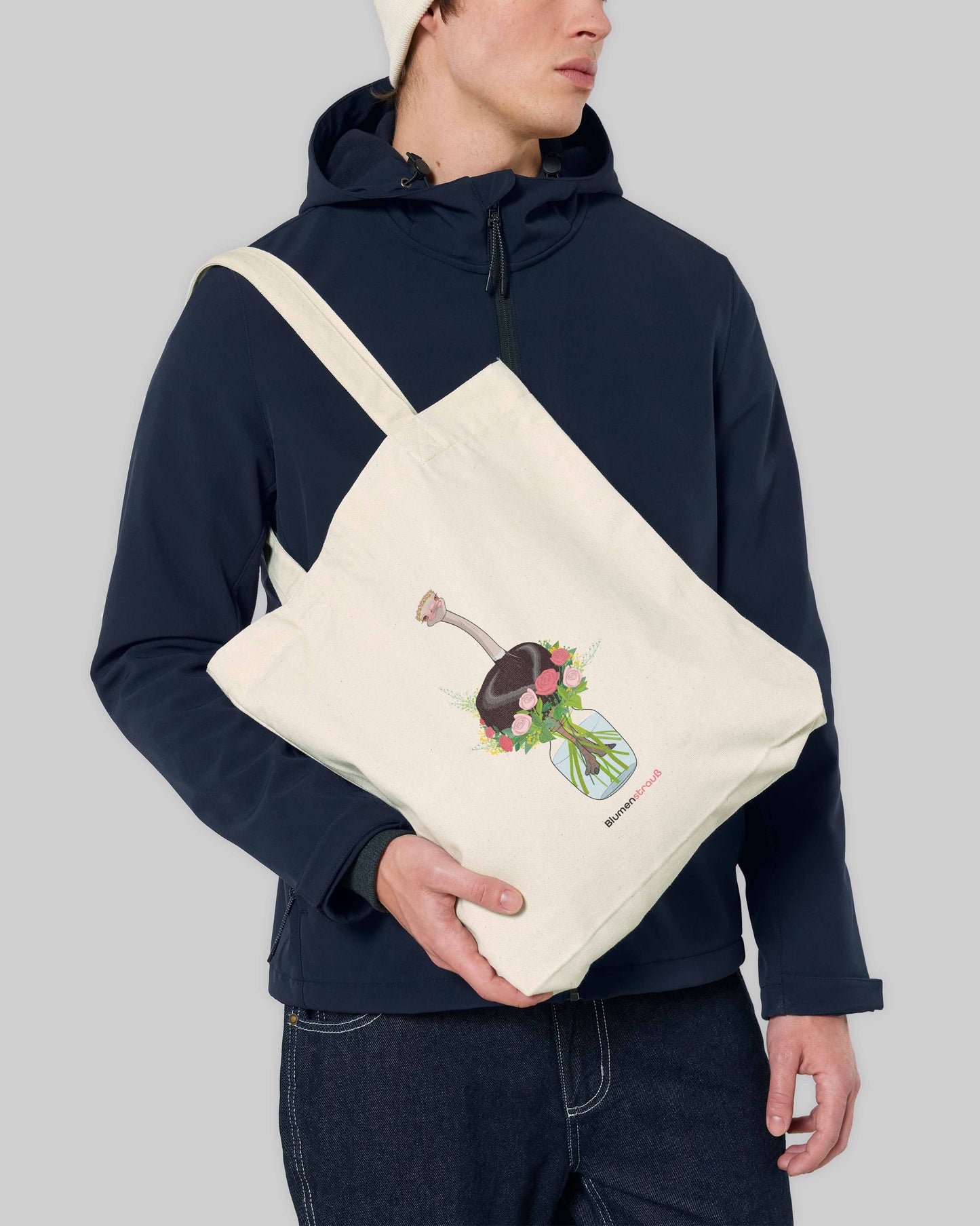 EINHORST® Stofftasche in der Farbe "Natural" mit dem Motiv "Blumenstrauß", Bild von männlicher Person mit Stofftasche
