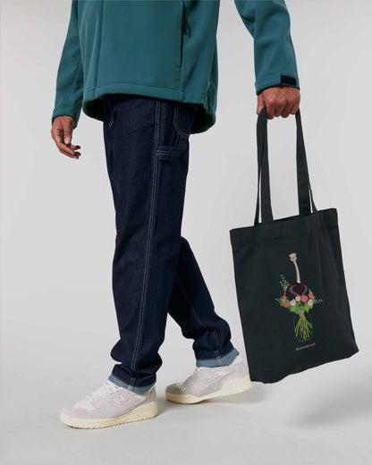 EINHORST® Stofftasche in Schwarz mit dem Motiv "Blumenstrauß", Bild von männlicher Person mit Stofftasche