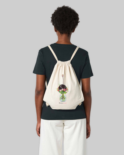 EINHORST® Sportbeutel in der Farbe "Natural" mit dem Motiv "Blumenstrauß", Bild von männlicher Person mit Sportbeutel